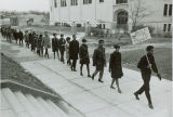 Civil rights demonstrators march single file