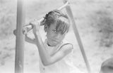 Dannice Simon on a playground during a cookout in the Madison Park community in Montgomery, Alabama.