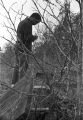 Thumbnail for Norman Lumpkin, news director for WRMA radio, making notes while examining an open grave at Lincoln Cemetery in Montgomery, Alabama.