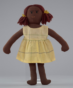 Female doll with tan clothing