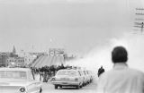 Alabama state police releasing tear gas on civil rights marchers crossing the Edmund Pettus Bridge in Selma, Alabama, on Bloody Sunday.