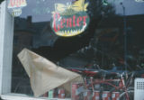 Broken store window in downtown Tuskegee, Alabama, after a riot that broke out during a demonstration by the Tuskegee Institute Advancement League.