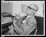 Genial Robert Douglas, who operates the Renaissance Casino, with his cat Rennie