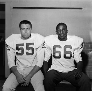 Two football players with shoulder pads, 9