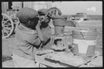 Children of Negro sharecropper pumping water. Family will be resettled at Transylvania Project, Louisiana