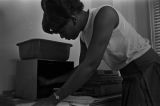 Mary Corbin working at the Southern Courier office in the Frank Leu Building in Montgomery, Alabama.