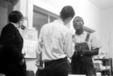 Roosevelt Barnett speaking to two men in an office, possibly the headquarters of the SCLC in Montgomery, Alabama.