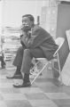 Arlam Carr sitting at a staff meeting at the Southern Courier office in the Frank Leu Building in Montgomery, Alabama.