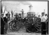 Group gathers around fire engine