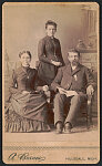 [Unidentified Civil War veteran wearing Grand Army of the Republic medal with his wife and daughter]