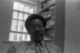 John Blassingame: New York. John Blassingame seated in office, Fredrick Douglas portrait on the wall (BLJP 1-79 #101)