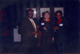 Three people at an Ethnic Alumni Association reception, 2001