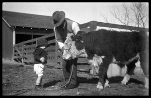 Man and Toddler with a Calf