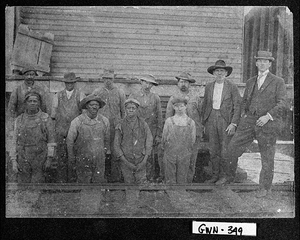 Photograph of mill workers posing outdoors, Gwinnett County, Georgia, 1907