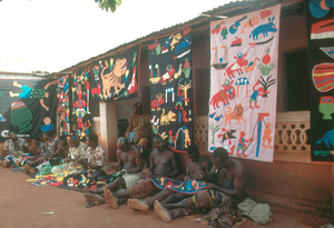 Appliqué workers, in street, Abomey, Benin