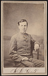 [Unidentified soldier in Confederate uniform in front of painted backdrop]