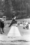 Carl Lewis completing a broad jump, Los Angeles, 1982