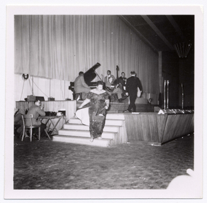 Ella Fitzgerald walking down steps from stage, also Oscar Peterson (piano), Ray Brown (bass), Herb Ellis (guitar), Buddy Rich? (drums), undated.] [Black-and-white photoprint