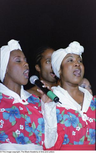 Singers performing at the Ashe Caribbean event