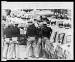 A solid block of Alabama state troopers and their cars stand by for the announced march of civil rights demonstrators ... Selma officials have stated that march would be blocked