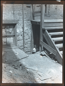 Girl under house steps : photonegative.