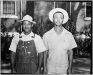 Celebrations around the awarding of a 1943 Army Navy E Award to the Avondale Mills, Sylacauga, Alabama. This photograph is of two African-American mill workers