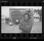 Richard Wyatt with his mural of Cecil Fergerson at the Watts Towers Arts Center, Calif., 1989