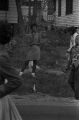 Bystanders at a homecoming parade through a neighborhood in Montgomery, Alabama.