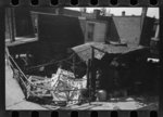 [Untitled photo, possibly related to: Negro backyard, Washington, D.C. Backyard near Stratford Hotel and within short distance from both the Capitol and Union Station, showing flooded yard and debris. In big rains, kitchen and bedroom floors of this house are so flooded that it is necessary to lay planks on them, the inhabitants say]