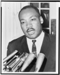 Thumbnail for [Rev. Martin Luther King, head-and-shoulders portrait, standing behind a row of microphones, facing front, outside the White House, after meeting with President Kennedy]