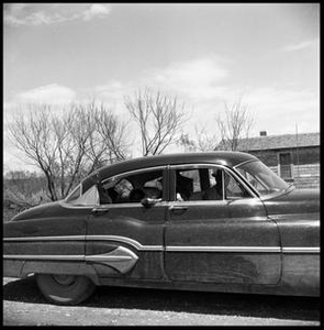 Children Waving from a Car