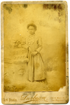 Portrait of unidentified girl standing with her right arm resting on a pillar