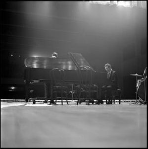 Dave Brubeck Quartet playing jazz, from behind