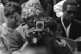 Woman photographing Martin Luther King's casket at South View Cemetery.