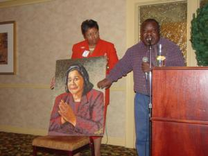 People holding Coretta Scott King painting