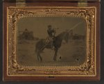 [Unidentified soldier in Union uniform atop horse blowing bugle while unsheathing sword]