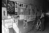 James "Son" Thomas and Joe Cooper in Leland, Mississippi. Bar, shoeshine parlor, promotional posters. (JTP 5-76-3)