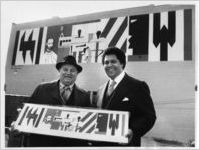 Romare Bearden with Mayor Maynard Jackson in front of the Kutz Building mural