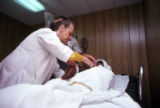 Doctor examining patient at a prison hospital