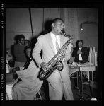 [Store Front Churches. Man playing saxophone]