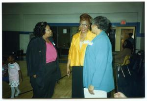 Links Members in Conversation in Gymnasium