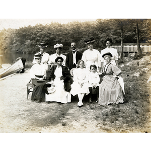 Family portrait taken on river bank