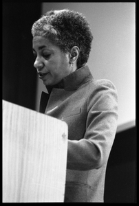 June Jordan, speaking at the podium