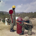 Soldiers practicing with rifles at the U.S. Army training facility at Fort McClellan near Anniston, Alabama.