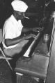 Blues Singers: Tutwiler, Miss. Lee Kizart playing the piano and Tom Dumas on fiddle (BSP H-68 #129)