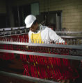 Employees making hot dogs in the R. L. Zeigler Company meat-packing plant, probably in Bessemer, Alabama.