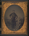 [2nd Class Boy George W. Brown of U.S.S. North Carolina, U.S.S. Ohio, and U.S.S. Powhatan in uniform in front of painted backdrop showing ship interior with sea beyond]