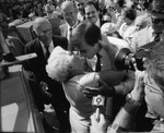 Jerry Brown receiving a greeting among a crowd, Los Angeles