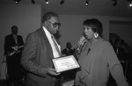 Guy Crowder receiving an ward at a supper club, Los Angeles, 1991