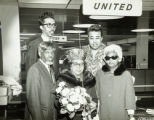 Group standing in front of United Airlines sign